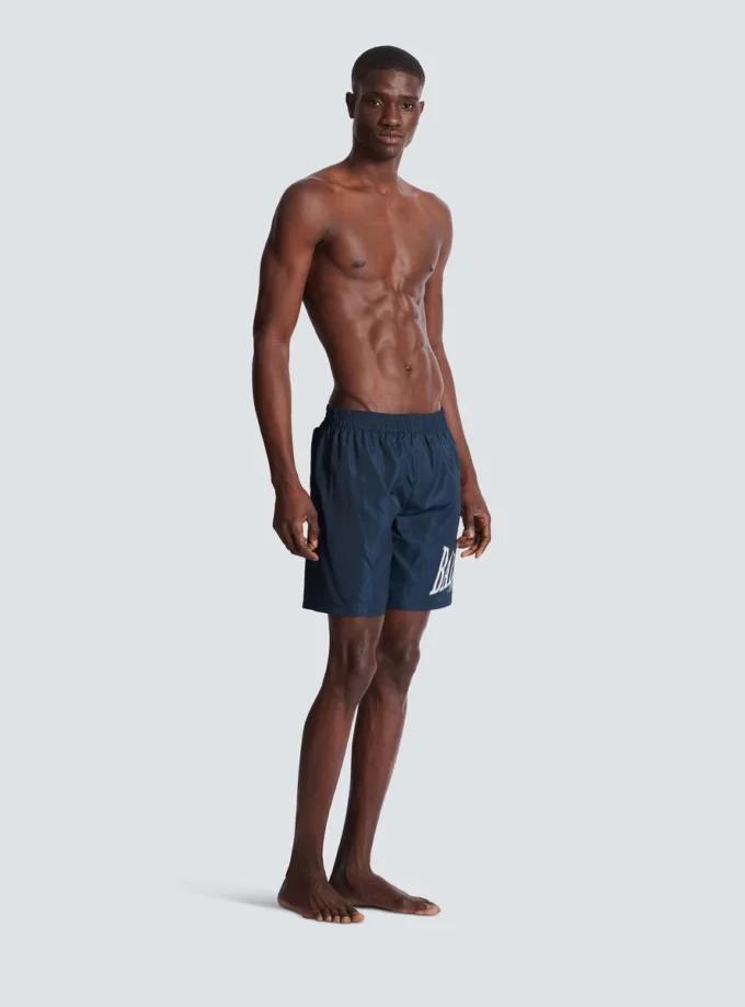 Swim shorts with Balmain College logo